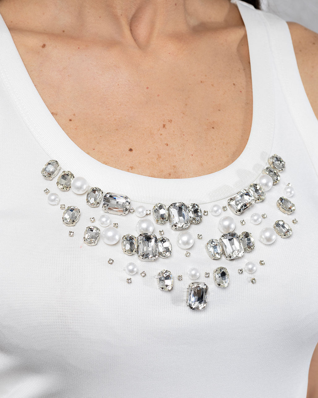 CrystalEdge | Gizia Sleeveless White Top with Stone Embellished Neckline